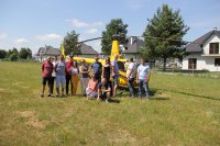 Spotkanie integracyjne, Zalew Zegrzyński 2019, Zespół Hydrostop przed lotem Śmigłowcem Robinson R44 Raven II. Lot nad Zalewem Zegrzyńskim i Zaporą Dębe.